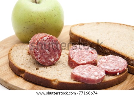 Garlic salami on bread with apple