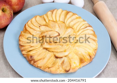 Homemade apple pie with apple, eggs and rolling pin