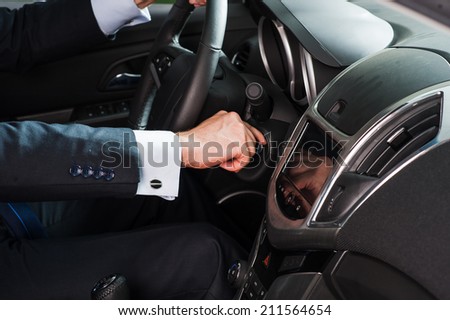 a man starts a car
