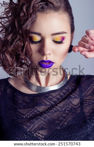fashion capture beautiful sexy girl with bright makeup, big full lips with purple lipstick, beautiful hair. Photography makeup, beauty, bright eye shadow