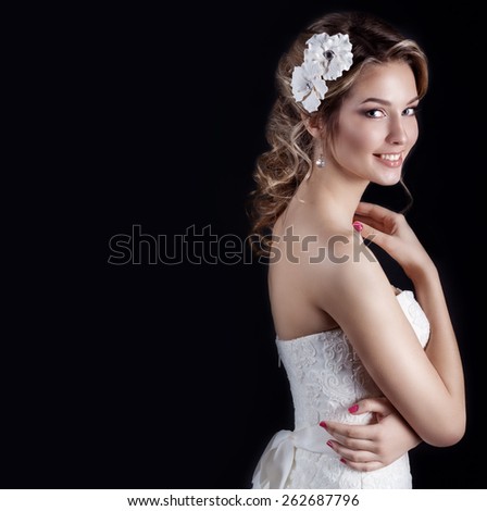 beautiful young sexy elegant happy smiling woman with red lips, beautiful stylish hairstyle with white flowers in her hair, the way for the bride at a wedding