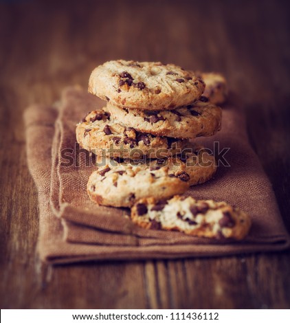 Stacked Chocolate Chip Cookies On Brown Napkin