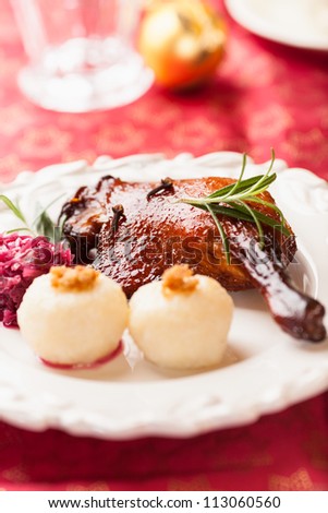 Roasted duck leg with potato dumplings and red cabbage for christmas