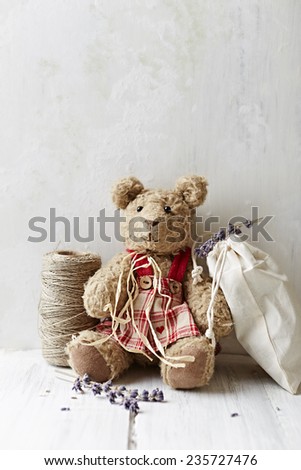 Still life with an old Teddy bear, a kitchen twine and lavender