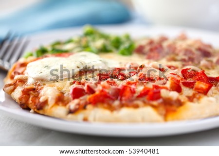 Pizza with mozzarella ham and vegetables