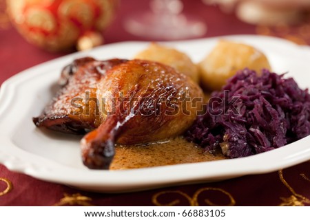 Roast duck legs with potato dumplings and red cabbage for christmas