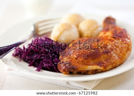 Roast chicken with red cabbage and potato dumplings