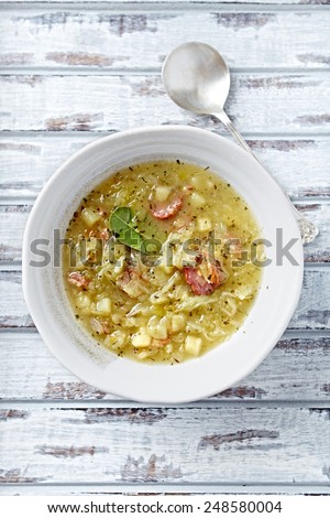 Cabbage soup with sausage (vegetable soup of sauerkraut; Poland)