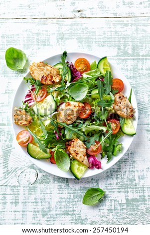 Chicken salad with leaf vegetables and cherry tomatoes