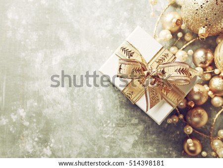 Christmas Present with Gold Ribbon and Gold Christmas Decorations
