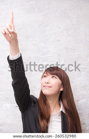 Business woman pointing showing and looking to the side up