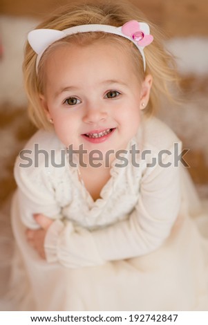 little girl wearing a kitty headband, Christmastime, New Year holiday concept