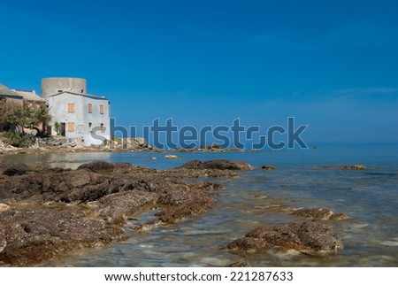 TOLLARE, CORSICA - MAY 11, 2012: Old fisherman house on the sea shore at Tollare on May 11, 2012.