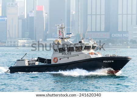 HONG KONG, CHINA - DEC. 31, 2014: Patrol boat of Hong Kong Marine Police patrols Victoria Harbour on Dec. 31, 2014 in Hong Kong, China.