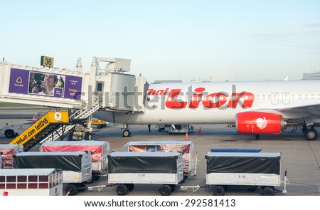 BANGKOK, THAILAND - JUNE 28,2015: Passengers boarding airplane boeing 737-900ER of Lion Air at the Don Mueang airport