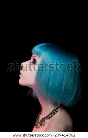 Profile portrait. Blue hairstyle. Hair coloring.