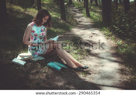 Beautiful woman reading book