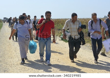Sid, Serbia - September 18th, 2015: Syrian refugees getting off the bus and goin from Serbia towards Croatia, on theri way to European Union. Photographed at the bordere Serbia-Croatia