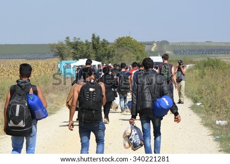 Sid, Serbia - September 18th, 2015: Syrian refugees getting off the bus and goin from Serbia towards Croatia, on theri way to European Union. Photographed at the border Serbia-Croatia,