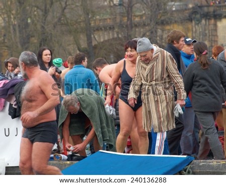PRAGUE - DECEMBER 26, 2014:  An old man who started in the 66th annual competition in winter swimming  - Memorial of Alfred Nikodem on Vltava river next to the National Theatre.