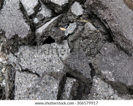 Pile of broken asphalt in the street surface