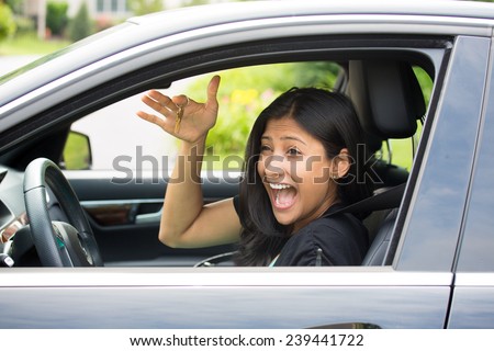 Closeup portrait, young cheerful, joyful, smiling, gorgeous woman holding up keys to her first new car. Super funny excitement. Customer satisfaction