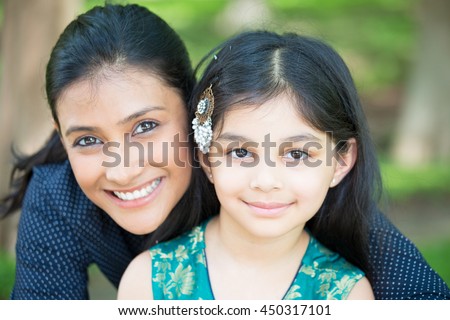 Closeup portrait, family looking at camera, isolated outdoors outside background
