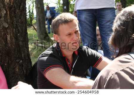 Khimki, Moscow region, Russia - August 19, 2012. Politician Alexei Navalny talks with activists in Khimki forest. Representatives of different political forces gathered to propose the single candidate