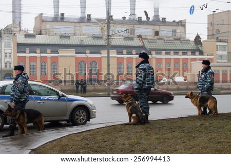 Moscow, Russia - March 1, 2015. The Russian police and dogs on oppositional march. March to the memory of Boris Nemtsov, Russian opposition leader who was assassinated on the eve of