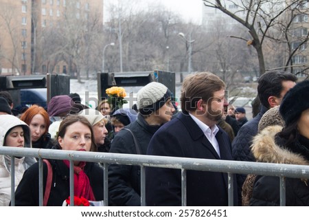 Moscow, Russia - March 3, 2015. Ecologist Alla Chernyshova and Governor Nikita Belykh in the queue at the funeral of Boris Nemtsov. Farewell to the oppositionist Boris Nemtsov, who was killed