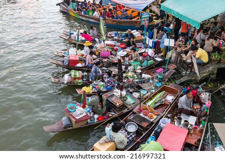 Ampawa Floating Market - Jan 4, 2014: The most famous floating market in Thailand sees as variety of Thai Traditional Food.