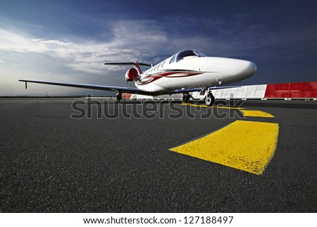 Small business jet plane on a runaway