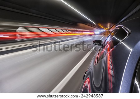 Driving a car at night trough tunnel