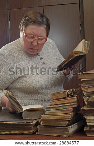 old woman in library with religious books