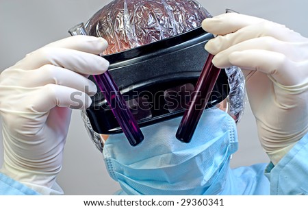 woman laboratory assistant whit chemical glasses