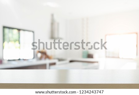 Empty wooden table platform blur kitchen background for presentation product.