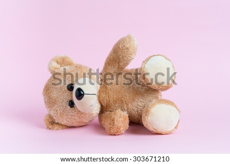 Teddy Bear toy alone with light pink background