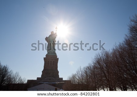 Statue of Liberty in New York.  The silhouette emphasizes the form of the statue.