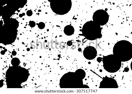 Drops of black ink on a white background.