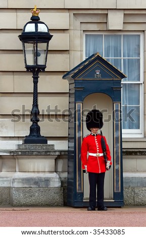 BUCKINGHAM PALACE GUARD - APRIL 27: Guard stands in front of Palace April 27, 2008 in London. Buckingham Palace is the official London residence of the British monarch.