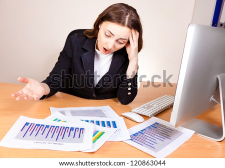 Displeased woman with a financial reports
