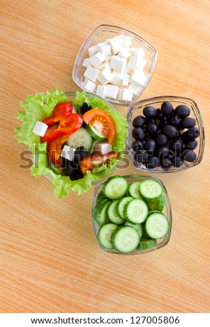 Picture of plates with vegetables and greek salad