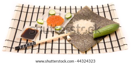Sushi ingridients on a bamboo sushi mat