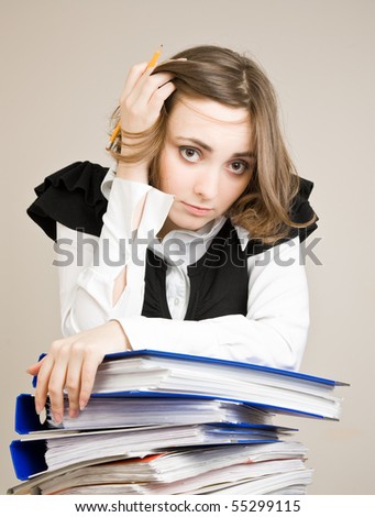 Tired secretary with a lot of documents