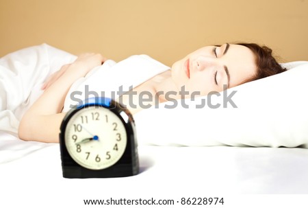 Woman sleeping in bed (focus on woman)