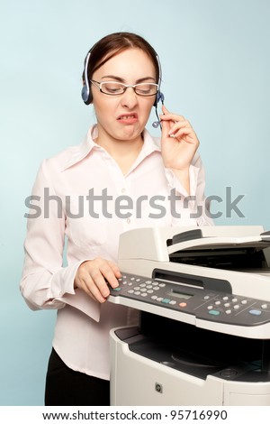 Angry businesswoman with copier thinking on the  background