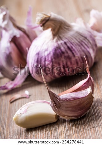 Garlic bulb on wooden background. Fresh garlic