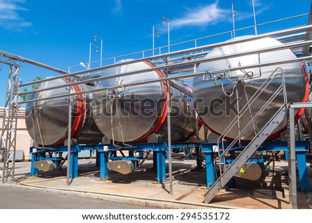 Modern metal tanks for maturing and cooling wine in a horizontal position.