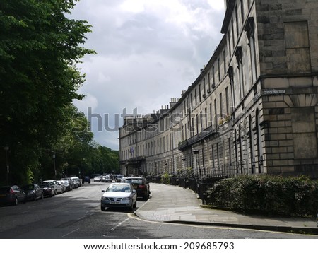 SCOTLAND, EDINBURGH -  April 5, 2013: An old street with parked cars in Edinburgh