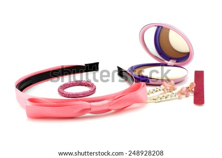 Pink hair accessories, powder and nail file